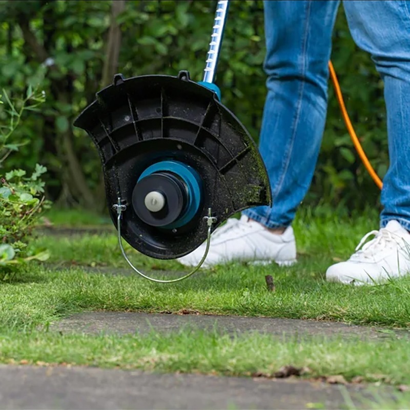 Триммер садовый электрический Makita 450Вт (UR3000) фото 9