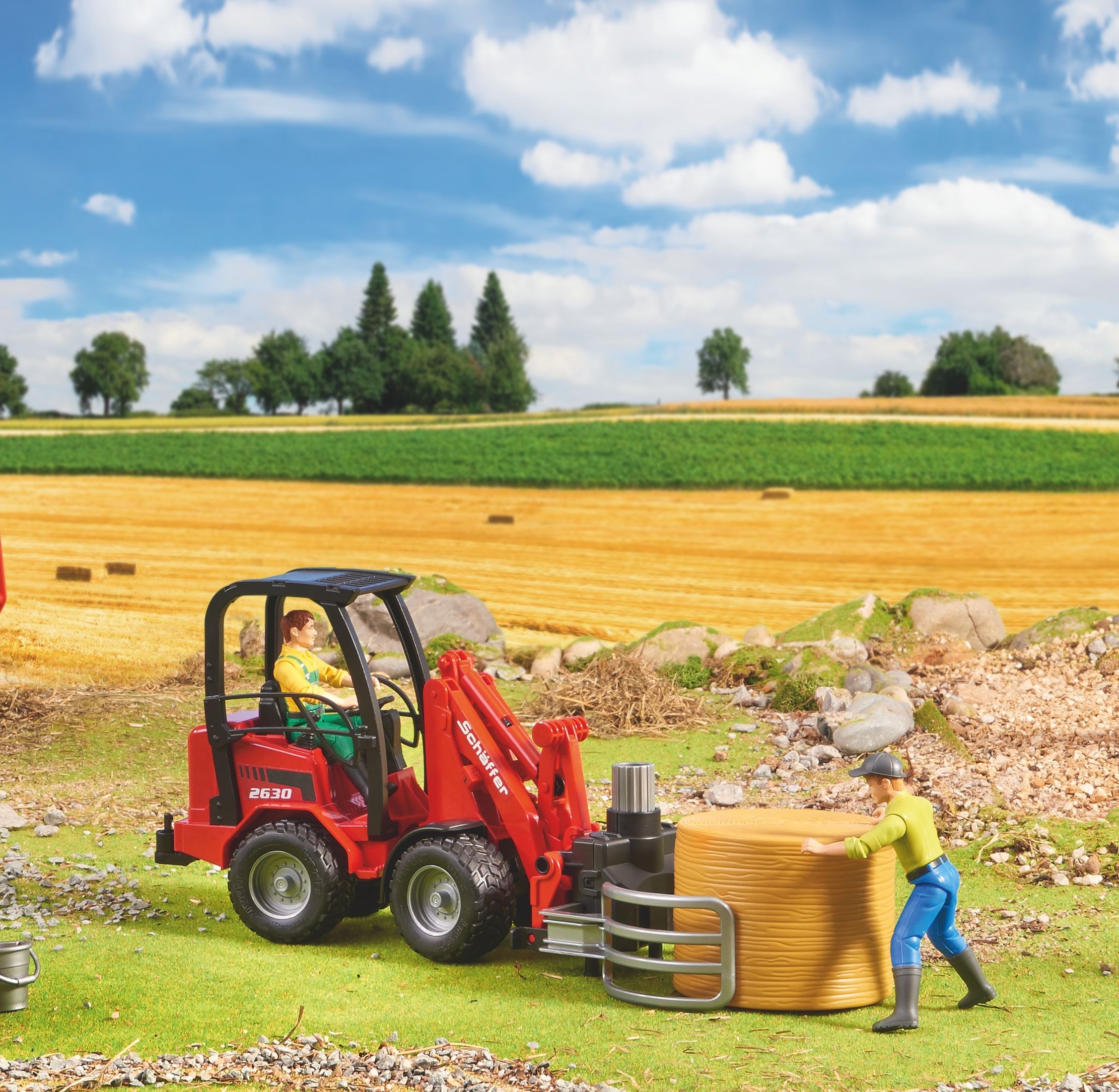 Минипогрузчик Bruder Schaffer Compact 2630 с аксессуарами (2192) фото 